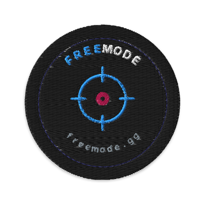 freemode embroidered patch — the crosshair badge stitched in blue on a round black patch