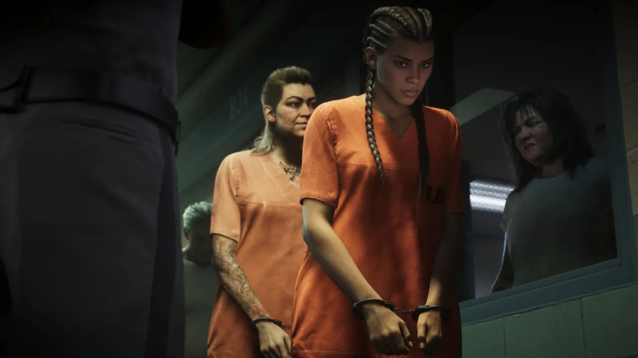 Lucia handcuffed in an orange jumpsuit inside the penitentiary — official screenshot